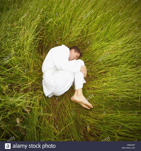 A Man Lying In The Grass In The Fetal Position Stock Photo, Royalty Free Image: 31904118 - Alamy Grass Drawing, Relaxing Images, Fetal Position, Men Lie, Human Reference, Guy Drawing, Male Poses, Stock Photography Free, Nature Paintings