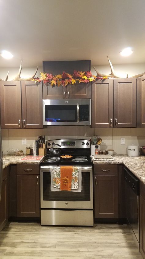 Fall decor with antlers Antler Decor Above Kitchen Cabinets, Antler Kitchen Decor, Antlers Above Kitchen Cabinets, Decor With Antlers, Decor In Kitchen, Decor Above Kitchen Cabinets, Birch Floors, Kitchen Flooring Options, Antler Decor