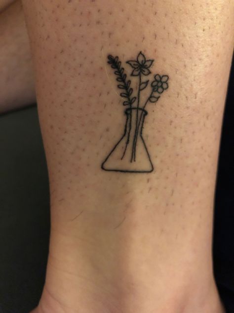 Flowers, Erlenmeyer flask, science, biology, scientist Biology Major Tattoo, Fine Line Science Tattoo, Erlenmeyer Flask Flower Tattoo, Forensic Science Tattoo Ideas, Cute Chemistry Tattoos, Biology Themed Tattoos, Erlenmeyer Flask Decoration, Matching Science Tattoos, Dainty Science Tattoo