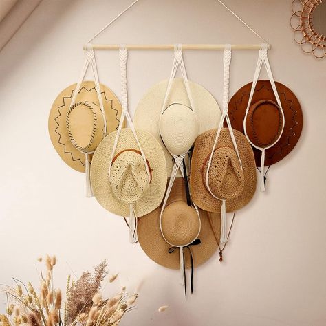 The hat hanger adopts a classic modern bohemian design, not only organize your hat neatly, but you can also fill the space on the empty wall and as a boho hanging decoration. the thread will not be pressed too much to flatten the hat, and it can effectively hold the hat and prevent it from falling off. Perfect for wide brim hat, like cowboy hats, sun hat, beach hat, etc. Boho Chic Hats, Bohemian Hat, Hat Hangers, Space Saving Shelves, Wall Hats, Scarf Organization, Hanging Hats, Hat Organization, Hat Holder