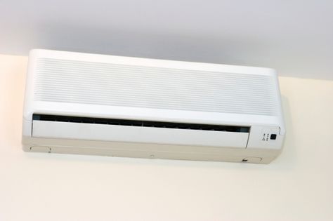 A ductless mini-split air conditioner is one solution to cooling part of a house. | Photo courtesy of ©iStockphoto/LUke1138. Ductless Ac, Door Overhang, Tiny House Appliances, Ductless Air Conditioner, Split System Air Conditioner, Ductless Mini Split, Window Casing, Hvac Unit, Door Awnings