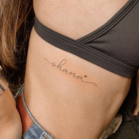 Ohana Rib Tattoo, Name Tattoo Danty, Ohana Script Tattoo, Ohana Tattoo With Flower, Ohana Tattoos, Ohana Tattoo Ideas, Ohana Tattoo, Wrist Tattoo Ideas, Magic Runes