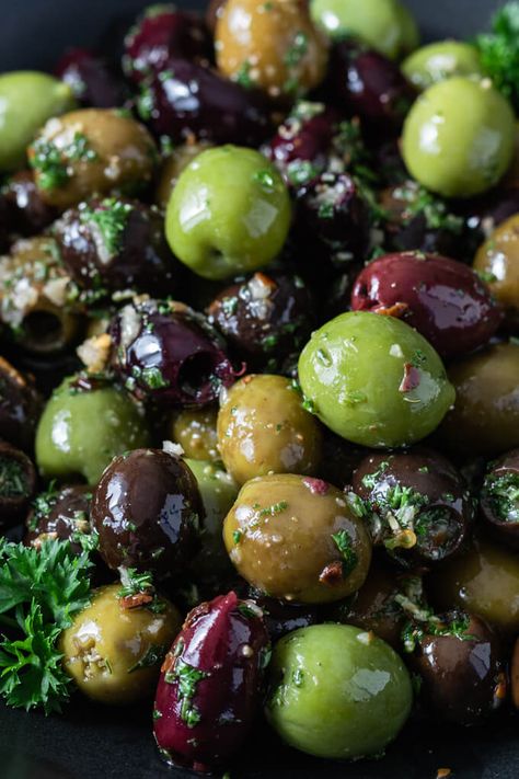 This easy Marinated Olives appetizer recipe is full of delicious Mediterranean flavor. Fresh herbs, spices, garlic and olive oil combine to create a savory low carb snack perfect for cheese platters and charcuterie boards. Marinated Green Olives, Marinated Black Olives, Olive Marinade Recipe, Black Olive Recipes, Olive Marinade, Spiced Olives, Marinated Olives Recipe, Wine Platter, Black Olives Recipes