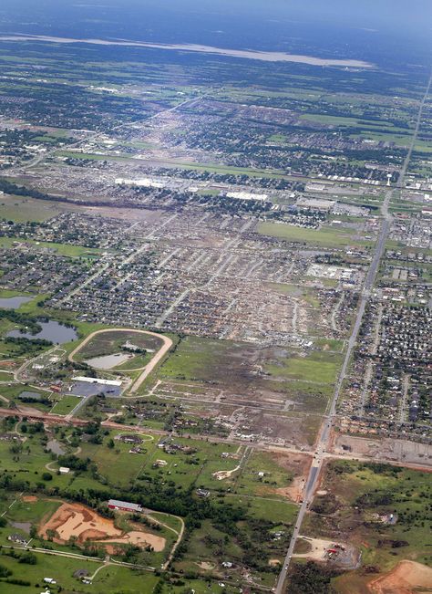 Oklahoma City Tornado 2013: Storms Tear Across Central U.S.   This Tuesday, May 21, 2013 aerial photo shows, from bottom to top, the path Monday's tornado took through Moore, Okla. The huge tornado roared through the Oklahoma City suburb Monday, flattening entire neighborhoods and destroying an elementary school with a direct blow as children and teachers huddled against winds. (AP Photo/Kim Johnson Flodin) Moore Oklahoma Tornado 2013, Oklahoma Living, Moore Oklahoma, Tornado Pictures, Oklahoma Tornado, Bank Vault, Oklahoma History, Storm Chasing, Red Earth