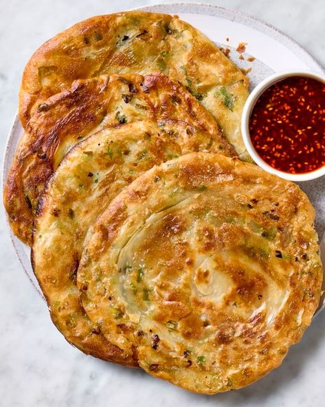 Scallion Pancakes Recipe (Easy & Extra Flaky!) | The Kitchn Pancakes Recipe Easy, Chili Dipping Sauce, Scallion Pancakes Chinese, Scallion Pancake Recipe, Indian Pancakes, Scallion Pancakes, Pancake Recipes, Pancake Recipe Easy, Meat Free