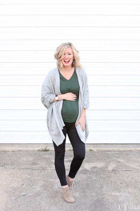 Thanksgiving is a tough holiday to dress for. You want to be comfortable to accommodate all of the food you're going to eat..but you also want to be cute! Here's a cute maternity outfit for the holiday. Black leggings and a blanket wrap, plus cute booties. #maternityclothes Comfy Maternity Work Outfit, Winter Maternity Outfits Leggings, Plus Maternity Outfits, Thanksgiving Outfit Pregnant, Thanksgiving Pregnancy Outfit, Holiday Maternity Outfits, Thanksgiving Maternity Outfit, Maternity Thanksgiving Outfit, Maternity Christmas Outfit