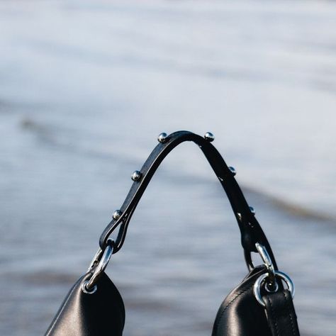 SONYA LEE BAGS on Instagram: "Francesca, captured here gracefully floating above water. With its striking design adorned with bulbous post studs and oversized O-Rings, this bag makes a bold statement. The magnetic closure ensures the security of your essentials, while the versatile design allows it to easily transition from a top handle to a shoulder bag or crossbody." Sonya Lee Bag, O Ring, Magnetic Closure, Bag Making, Top Handle, Floating, Shoulder Bag, Water, Instagram