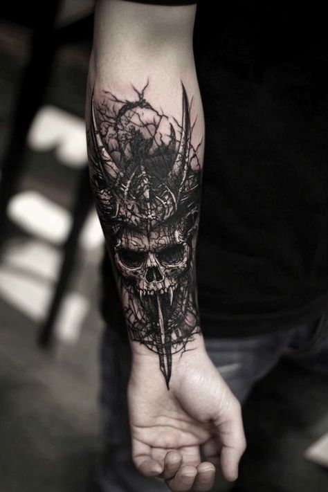 Forearm tattoo featuring a detailed skull with horns and intricate dark designs. Vampire Skull Tattoo, Dark Themed Tattoos, Eerie Tattoos, Mesmerizing Tattoos, Dark Tattoo Designs, Dark Gothic Tattoo, Dark Tattoo Ideas, Eve Tattoo, Grim Fairy Tales