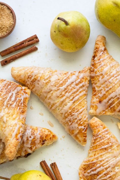 golden brown baked and glazed pear turnovers Pear Turnovers Puff Pastries, Pear Danish, Pear Pastry, Pear Turnovers, Pear Puff Pastry, Cooked Pears, Fall Pastries, Glazed Pears, Carmelized Pears