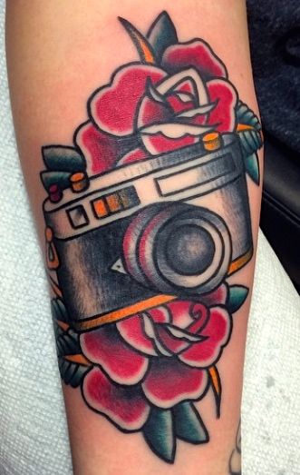 Traditional camera with roses done by Matt Nemeth. Cover Ankle Tattoo, American Traditional Camera Tattoo, Old School Camera Tattoo, Traditional Tattoo Camera, Camera Tattoo Ideas, Polaroid Tattoo, Rose Vine Tattoos, Outdoors Tattoos, Tattoos Celebrities