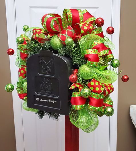 Did you decorate with lime green and red decor this Christmas? Here's the perfect mailbox swag to completely set your yard apart from your neighbors. Shop more Christmas mailbox swags in our Etsy Shop. https://FlorEssenceDesigns.etsy.com #checkyourmailbox #happymailbox #themailbox #mailboxoftheday #mailboxes #mailboxlove #mailboxhappiness #curbappeal #merrychristmasyall #christmashome #handmadewreath #availableonetsy #christmasintheair #housedecorations Christmas Mail Box Decorations, Grinch Mailbox Decor, Mailbox Christmas Decorations Diy, Mailbox Swag Diy How To Make, Mailbox Christmas Swag, Mailbox Christmas Decorations, Holiday Mailbox Swag, Green And Red Decor, Christmas Mailbox Decor