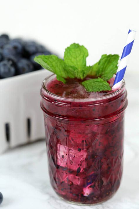 This Huckleberry Hooch is my new favorite blueberry cocktail recipe.  It's bursting with fresh blueberry flavor and perfect for warm summer days. Huckleberry Moonshine Recipe, Blueberry Moonshine, Peach Moonshine, Blueberry Cocktail, Moonshine Cocktails, Wedding Signature Drinks, Moonshine Recipes, Berry Dessert, Easy Blueberry