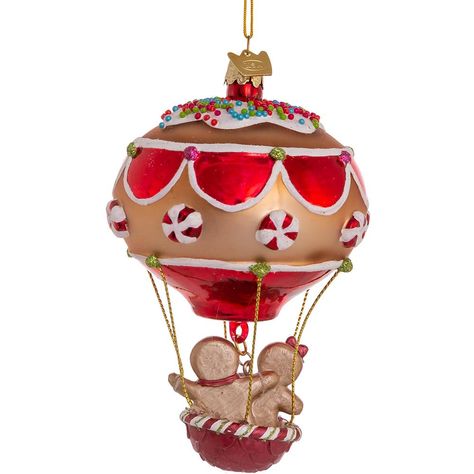 Love is in the air this holiday season as a gingerbread gent takes his lovely lady up for a ride in a peppermint candy hot air balloon. This delightful glass ornament from Kurt Adler's Noble Gems™ collection sparkles and shines with glossy paint, glitter, and even cupcake “sprinkles” atop the whimsical balloon. It’s sure to delight and is a perfect gift for newlyweds or couples celebrating a milestone anniversary. Your gingerbread couple and their balloon are 4.75" tall. Hot Air Balloon Ornament, Holiday Balloons, Christmas Ornament Storage, Gingerbread Ornaments, Hot Air Balloon Rides, Gingerbread Girl, Balloon Shapes, Christmas Material, Kurt Adler