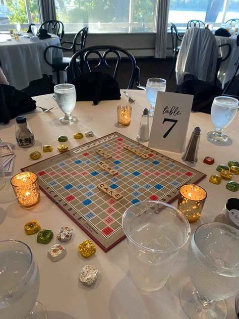 Boardgame Centerpieces Wedding Reception, Board Games Wedding Centerpieces, Scrabble Centerpieces, Wedding Board Games Table, Board Games At Wedding, Game Wedding Centerpieces, Board Game Wedding Theme, Gameboard Centerpieces, Board Game Wedding Centerpieces