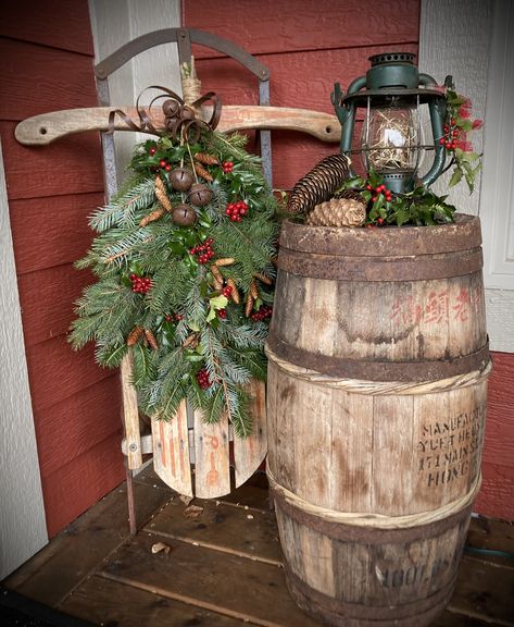 Whiskey Barrel Winter Decor, Wine Barrel Porch Decor, Old Sleigh Christmas Decor, Outdoor Whiskey Barrel Christmas Decor, Christmas Wine Barrel Front Porch, Old Crocks Decor Ideas Farmhouse, Christmas Barrel Decor, Christmas Whiskey Barrel Decorations, Christmas Wash Tub Ideas