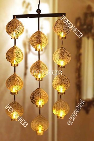 A beautiful iron candle stand like lighting Diwali Bohemian Drop Danglers, Elegant Brass Danglers For Diwali, Traditional Metal Danglers For Diwali, Diwali Brass Danglers With Intricate Design, Brass Hanging Diyas, Hanging Tea Light Holders, Tea Light Holder Hanging, Wooden Candle Stand, Hanging Tea Lights