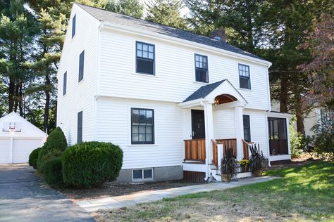 Keri Murray Architecture.  Garrison Colonial. exterior remodel. portico. 3 season porch. black windows white siding. white clapboard siding. White Colonial Exterior, Colonial Exterior Makeover, Colonial Exterior Remodel, Garrison Colonial Exterior, Garrison Colonial, Garrison House, Small Colonial, Colonial House Exteriors, White Colonial