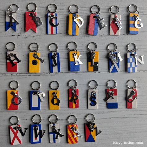 Hand painted nautical flag keychains. Each one represents a different letter of the alphabet and has a unique meaning when flown by a ship (or boat, especially sailboats) 🎨🖌️⚓⛵🚢 Shop Design Ideas, Buoy Decor, Sailing Logo, Maritime Flags, Nautical Signal Flags, Ways To Say Congratulations, Life By The Sea, Lakeside Beach, Nautical Flag