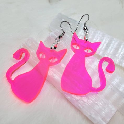 Fluorescent Pink Acrylic Mid Mid Cat Earrings ~ Measures Approx 1.75 inches  ~ Stainless Steel Hooks  ~ Laser Cut Acrylic ~ Very Lightweight ~ Processing times are up to two weeks but may be sooner ♥️😀♥️ follow us @iamsonotcoolvintage on instagram  save 10% :) Cute Cat Earrings, Pink Cat Design Jewelry With Cat Ears, Pink Halloween Earrings, Playful Pink Cat Design Jewelry, Pink Resin Novelty Earrings, Iridescent Earrings, Laser Cut Earrings Acrylics, 70s Jewelry, Mid Century Cat