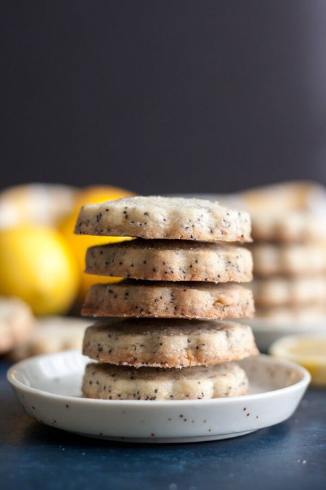 These Lemon Poppy Seed Shortbread Cookies are packed full of poppy seeds and the sweet tangy flavor of lemon. It’s the perfect bite to lift you into a happy mood. | wildwildwhisk.com #lemon #poppyseed #shortbread Lemon Poppy Seed Cookies, Poppy Seed Cookies, Buttery Cookie, Seed Cookies, Lemon Health Benefits, Afternoon Tea Recipes, Lemon Benefits, Crispy Cookies, Lemon Poppy Seed