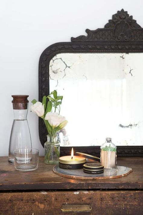 what to pick up, what to leave, and what to do with the stuff you keep. Wooden Antique Mirror, Guest Room Side Table Decor, Antique Mirror Styling, Matte Black Home Decor, Circle Mirror Bedroom, Black Antique Mirror, Wall Mirror Decor Ideas, Match Storage, Bedroom Vignette