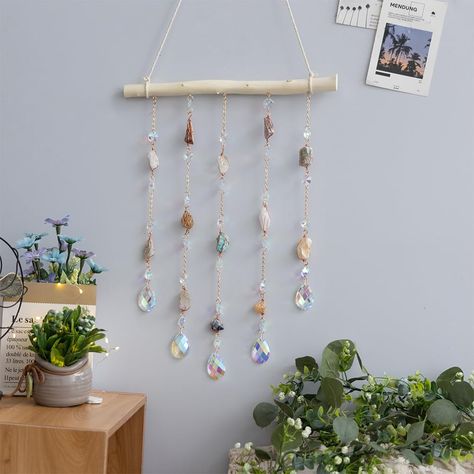 PRICES MAY VARY. Natural Crystal: Our natural crystal is carefully selected and cut to create a stunning and unique ornament that will add a touch of elegance to any room in your home. DIY Wooden Wall Hanging: The ornament comes with a wooden base and all the necessary hardware for easy assembly and hanging. You can customize the length and shape of the crystal to suit your preferences. Versatile Decor: The crystal ornament is perfect for decorating living rooms, bedrooms, dining rooms, kitchens Hanging Crystals Diy, Crystal Suncatchers Swarovski, Diy Wooden Wall, Bar For Home, Window Charm, Wire Wall Art, Home Decor For Living Room, Kitchen Wall Hangings, Stil Boho