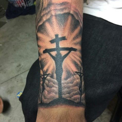 Star Tattoos For Men On Arm, Cross Clouds Tattoo, Three Crosses Tattoo For Men, Cross Sleeve Tattoo Men, Best Forearm Tattoo Men Small, Tattoo Ideas For Men Cross, 3 Crosses Tattoo Men, Cross Tattoos For Men Forearm, Small Forearm Tattoo Men