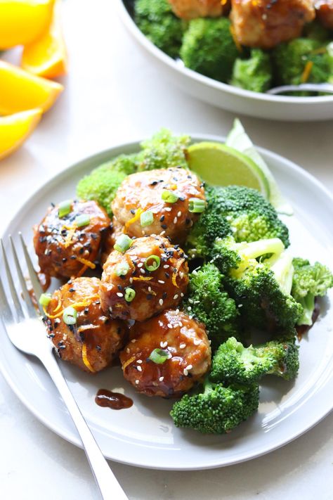 These Asian-inspired Whole30 and Paleo Orange Chicken Meatballs are amaaaaaze-balls (haha)! There's so much flavor in the Orange Hoisin sauce that this easy Paleo meatballs recipe will quickly become your new favorite weeknight dinner! I like to serve them with steamed broccoli for a complete meal that's Gluten Free, Paleo, and Whole30. #cookathomemom #whole30 #meatballs Orange Chicken Meatballs, Whole30 Meatballs, Orange Sesame Chicken, Paleo Orange Chicken, Paleo Meatballs, Asian Chicken Meatballs, Whole 30 Meatballs, Easy Orange Chicken, Chicken Meatball