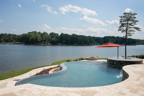 An infinity pool and spa on Hyco Lake, North Carolina. Design and build by Clearwater Construction Group of North Carolina. Lake House With Infinity Pool, Pool By Lake, Lakefront Pool, Small Landscape Design, Dream House Pool, Hillside Pool, Edge Pool, Landscape Design Ideas, Lake Fun