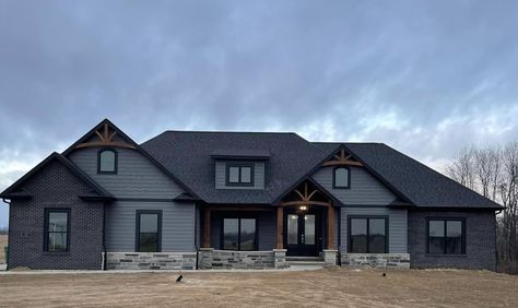 Ranch Style Homes Dark Exterior, Dark Gray Modern Farmhouse Exterior, Dark Gray Farmhouse Exterior, Dark Gray Houses, Black Stone Exterior, Dark Modern Farmhouse Exterior, Dark Farmhouse Exterior, Black Farmhouse Exterior, Dark Exterior House