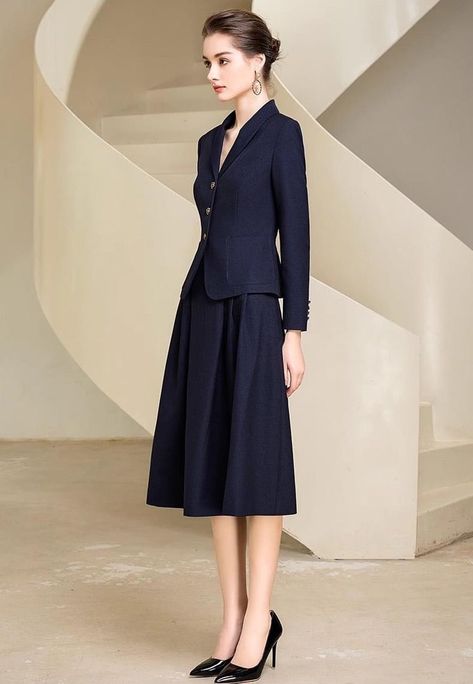 Look graceful and timeless in this two-piece chic midi skirt suit. With an elegant full skirt and tailored jacket, you'll feel timelessly elegant and sophisticated—perfect for work, special occasions, and everything in between. Make a statement in this beautiful skirt suit. Blazer and Full Midi Skirt V-Neck, Long sleeves Flap Pockets Structured shoulders. Polyester 100% Lining: Polyester 100% Imported Brand -Aision Model Number - 233017C1, 233017S2 Midi Skirt Suit, Blazer And Long Skirt Outfits, Suit Skirt Outfit Classy, Graduate Clothes, Woman Suit Fashion Classy, Business Professional Outfits Women, Coat And Skirt, Casual Classy Outfits, Long Skirt Suits