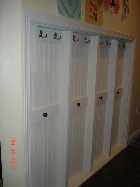 We don't have a mudroom, only a hallway way and we needed more organization and space.  I did these locker/cubbie things between the studs and trimmed them out.  I attached the bead board to the back of the opposing drywall and attached the boards the hooks are in with pocket screws.  The lower knobs are for backpacks to spread the bulk of the hanging stuff out. Narrow Closet Organization, Between The Studs, Between Studs, Garage Door Trim, Narrow Closet, Mudroom Cubbies, Entry Storage, Diy Hooks, Pocket Screws