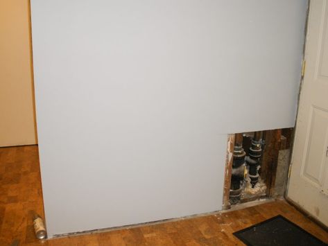 Hiding plumbing access with wainscoting Hide Door, Faux Wainscoting, Wainscoting Wall, Access Panel, Old Apartments, Wall Trim, Hidden Door, Upholstered Bench, Thinking Outside The Box