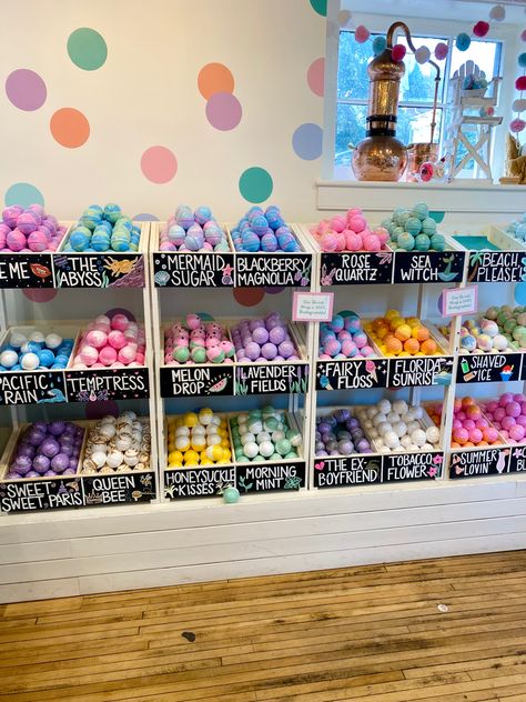 Image is of a wall of about 30 bins. Each bin has a few bath bombs of the same scent. The names of each bath bomb are written in chalk on the front of the bin. Some of the bath bomb names are “Mermaid Sugar,” “Melon Drop,” and “Fairy Floss.” Bathbomb Storage, Bath Bomb Organization Ideas, Bath Products Aesthetic, Bathbombs Ideas, Bath Bomb Display Ideas, Bath Bomb Inventory Storage Home Business, Bathbomb Display Retail, Bathbomb Aesthetic Storage, Spa Aesthetic