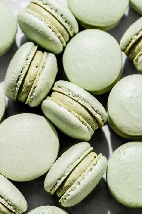 Bite into one of these pistachio macarons to experience the magic of a chewy shell contrasted with a creamy pistachio French buttercream. Follow my step by step photos and instructions to make your own bakery-worthy macarons! Blue Macaroons, Pastel Macarons, Macaron Recipes, French Buttercream, Le Macaron, Macaron Template, Pistachio Gelato, Macaron Filling, Pistachio Color