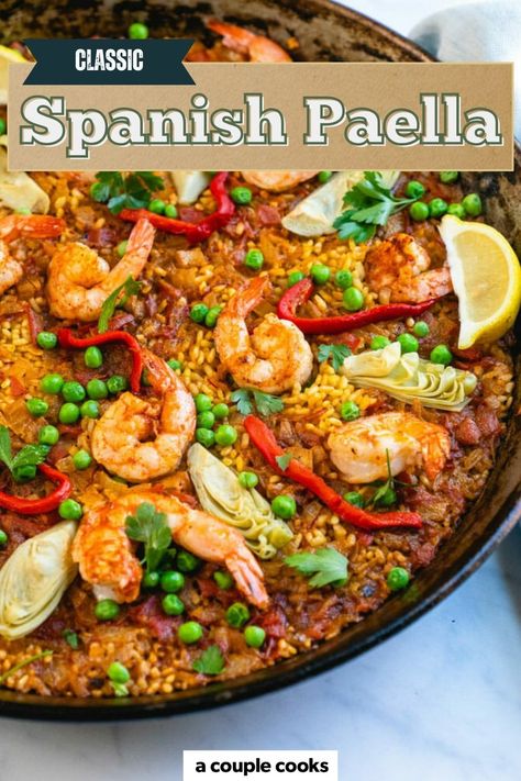 Here's how to make a paella recipe...the Spanish way! This stunning one pan dinner features shrimp, vegetables and all the authentic flavors of this traditional dish. #paella #recipe #paellarecipe #easypaella #bestpaella #classicpaella #shrimppaella Best Paella Recipe, Spanish Paella Recipe, Vegetarian Paella, Rice Shrimp, Best Fish Recipes, Winter Salad Recipes, Spanish Paella, A Couple Cooks, Paella Recipe