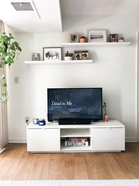 Apartment style, floating shelves, white apartment, gallery wall, floating shelves above tv, floating shelf ideas Wall Shelves Over Tv, Gallery Wall Ideas Floating Shelves, Lounge Room Wall Decor, Floating Shelves Living Room Above Tv, Shelf Above Tv Bedroom, Floating Shelves Behind Tv, Wall Shelves Above Tv, Shelf On Top Of Tv, 3 Floating Shelves Living Room