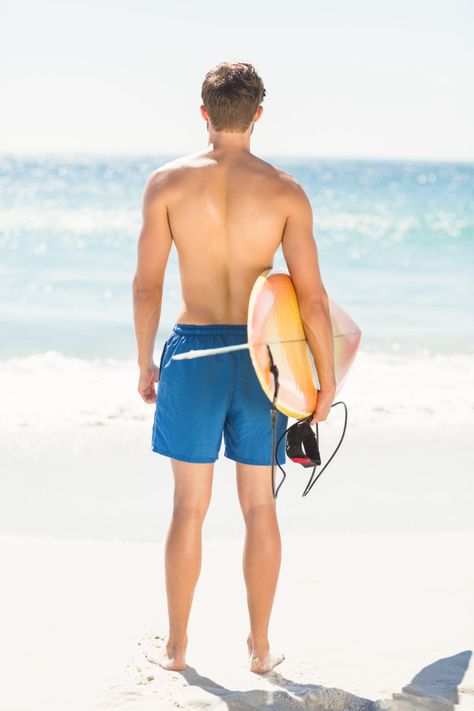 Wear view of handsome man holding surfboard Photo | Premium Download Surfer Holding Surfboard, Man Holding Surfboard, Man With Surfboard, Surfboard Art, Surfing Photography, Handsome Man, Premium Photo, Surfboard, Swim Trunk