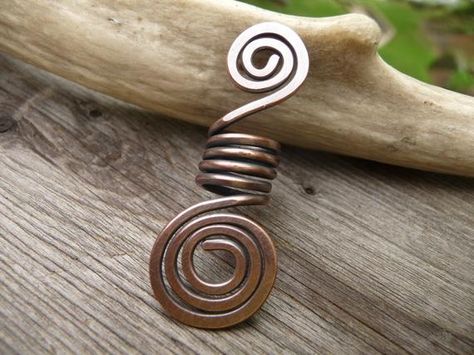 -Wire wrapped 8mm dreadlock/braid or beard bead made of solid copper in a simple rustic spiral design-Perfect for adding some interesting jewelry focus to your beard or locs. -Strong and sturdy hand forged designReady to ship.SIZE: 8mm hole opening1.75 inches long and 1/2 inch wide.FAQ'sQ. How do I know the size of dreadlock? And how do I add install one?**For information about how to measure to find out the size of your dreadlocks or how to install them, there are alot of great videos and infor Viking Hair Jewelry, Beard Accessories, Beard Beads, Interesting Jewelry, Dreadlock Beads, Braid Jewelry, Viking Hair, Dread Beads, Spiral Design