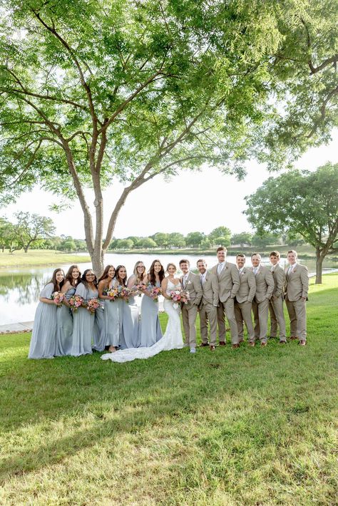 Wedding party photos at Sendera Springs with bridesmaids in light blue dresses and groomsmen in khaki suits. Head to the blog to see more of this Kerrville wedding! Blue Bridesmaid Tan Groomsmen, Groom In Tan Groomsmen In Navy, Light Blue And Khaki Wedding, Groomsmen With Sage Green Bridesmaids, Dusty Blue And Tan Wedding Party, Ice Blue Bridesmaid Dress With Groomsmen, Pale Blue Bridesmaid Dresses With Groomsmen, Wedding Party Light Blue, Light Blue Wedding Party Attire