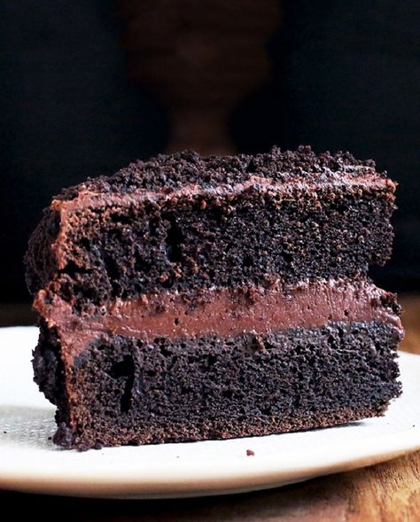 Ebinger's, a lost-but-not-forgotten Brooklyn bakery, made their original version of this cake famous. Our recipe, based on the spirit of Blackout Cake if not its exact ingredients, marries a moist chocolate layer cake with rich, pudding-like filling and thick ganache icing — plus Ebinger's trademark cake-crumb coating. Blackout Cake Recipe, Blackout Cake, Emergency Chocolate, Kahlua Cake, Ganache Frosting, King Food, Cake Layers, Homemade Sweets, Chocolate Layer Cake