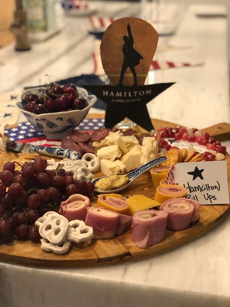 Host a Hamilton viewing party with themed charcuteire board  and lots of fun.  meat and cheese platter hamilton the musical themed birthday party family movie night quarantine activities Hamilton Movie Night, Hamilton Themed Food, Broadway Party Food, Hamilton Themed Party Food, Broadway Themed Birthday Party, Hamilton Party Decorations, Hamilton Party Food Ideas, Hamilton Themed Party, Hamilton Themed Birthday Party