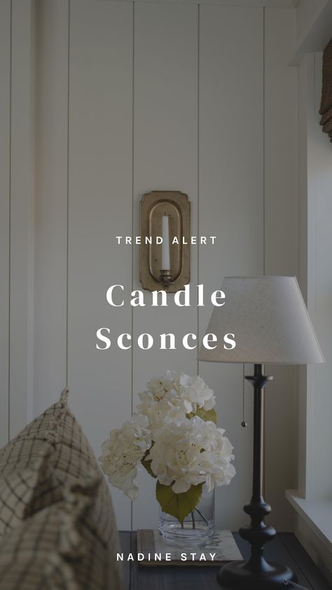 A Roundup Of My Favorite Candle Sconces. 26 tapered candle sconces and wired electrical candle sconces. When and where to use candle sconces instead of art. My favorite brass, black metal, and bronze candle sconces. Wall art ideas that aren't art. Vintage brass candle sconce with a white tapered candle. Bedroom wall decor ideas. Bedroom styling with a window vignette by Nadine Stay | #candlesconce #taperedcandle #brasssconce #bronzesconce #wallart #walldecor #vintagesconce #vintagecandlesconce # Fireplace Candle Sconces, Candlestick Sconces Living Room, Where To Put Candle Wall Sconces, Sconces On Tv Wall, Sconces And Artwork, Candle Wall Sconces Bedroom, Where To Put Wall Sconces, Hallway Candle Sconces, Where To Place Candle Sconces