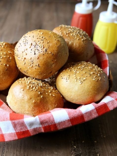 Soft and flavorful homemade burger buns made with 100% whole wheat and Red Star Yeast. I've already confessed my love for burgers, but in my opinion a burger is only as good as its bun. Whole Wheat Brioche Buns, Vegetarian Hamburger, Buns Hamburger, Brioche Burger Buns, Homemade Burger Buns, Hamburger Rolls, Healthier Baking, Red Star Yeast, Homemade Hamburger Buns