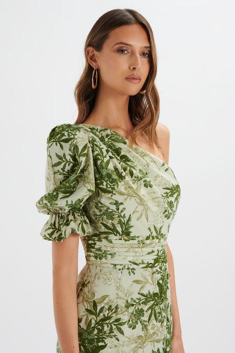 Incorporate floral elegance into your summer wardrobe with the NAKIA Asymmetric Puff Sleeve Midi Dress. Featuring an eye-catching botanical print and an asymmetric puff sleeve, this midi dress effortlessly combines style and comfort. The front split adds a touch of elegance, making it the perfect summer edition to your Puff Sleeve Midi Dress, Lavish Alice, Botanical Print, Printed Midi Dress, Botanical Prints, Perfect Summer, Summer Wardrobe, Day Dresses, Puff Sleeve