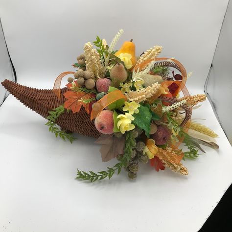 Brown Wicker Fall Cornucopia decorated with sugared pumpkin, fruits and fall flowers and leaves. The cornucopia basket measured 13 inches long x 7 inches wide. The total arrangement measured 21 inches long x 11 inches high x 14 inches wide( floral side). Cornucopia Centerpiece, Cornucopia Basket, Thanksgiving Cornucopia, Fruit Centerpieces, Fall Floral Arrangements, Fall Fruits, Flower Festival, Artificial Flower Arrangements, Scottsdale Az