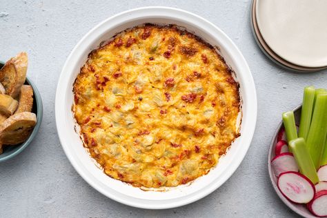 This easy artichoke dip is made with the addition of roasted red peppers (or pimentos if you prefer), which gives the dip a festive holiday look. Easy Artichoke Dip, Stuffed Cherry Tomatoes, Creamy Crab Dip, Artichoke Dip Easy, The Spruce Eats, Roasted Red Pepper Dip, Red Pepper Dip, Super Bowl Snacks, Red Pesto