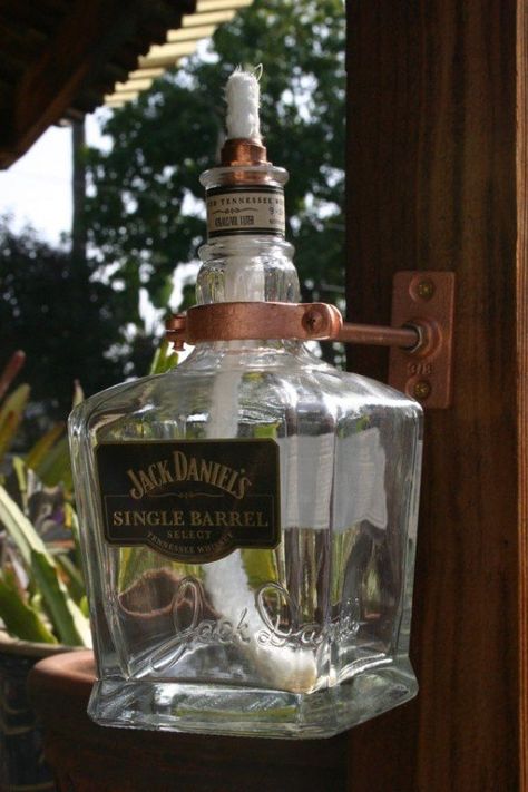 The jack daniels single barrel oil torch/lamp is a perfect combination of impressive style and functionality. The glass form has beautifully exposed the light, and the copper-plated handle is original. Tavern Ideas, Wine Bottle Tiki, Jack Daniels Single Barrel, Wine Bottle Tiki Torch, Blue Wine Bottles, Jack Daniels Bottle, Outdoor Torches, Outdoor Candle Holders, Round Paper Lanterns