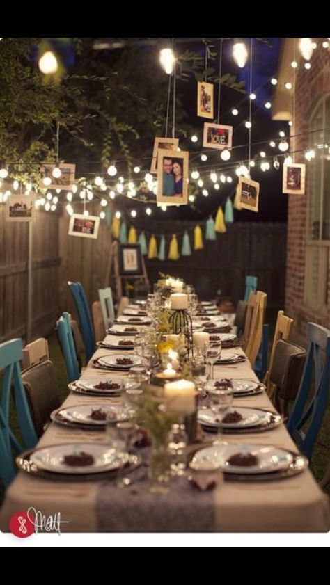 This is a beautiful 10 year wedding anniversary party idea! I love the white lights and the pictures hanging from the trees and the multiple colors of teal chairs. ❤️ 10th Wedding Anniversary Party, Anniversary Dinner Ideas, 25th Wedding Anniversary Party, 10th Anniversary Party, 40th Anniversary Party, 25th Anniversary Party, Wedding Anniversary Decorations, 50th Wedding Anniversary Party, 20 Wedding Anniversary