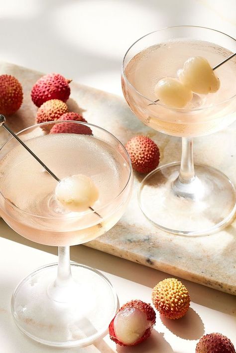 Learn how to make our favorite recipe for a Lychee Martini, which calls for vodka, lychee cordial, sherry, and a lychee garnish. Lychee Liqueur Cocktails, Litchi Cocktail, Lychee Martini Recipe, Lychee Mocktail, Lychee Drink, Lychee Cocktail, Martini Party, Fruity Design, Lychee Martini